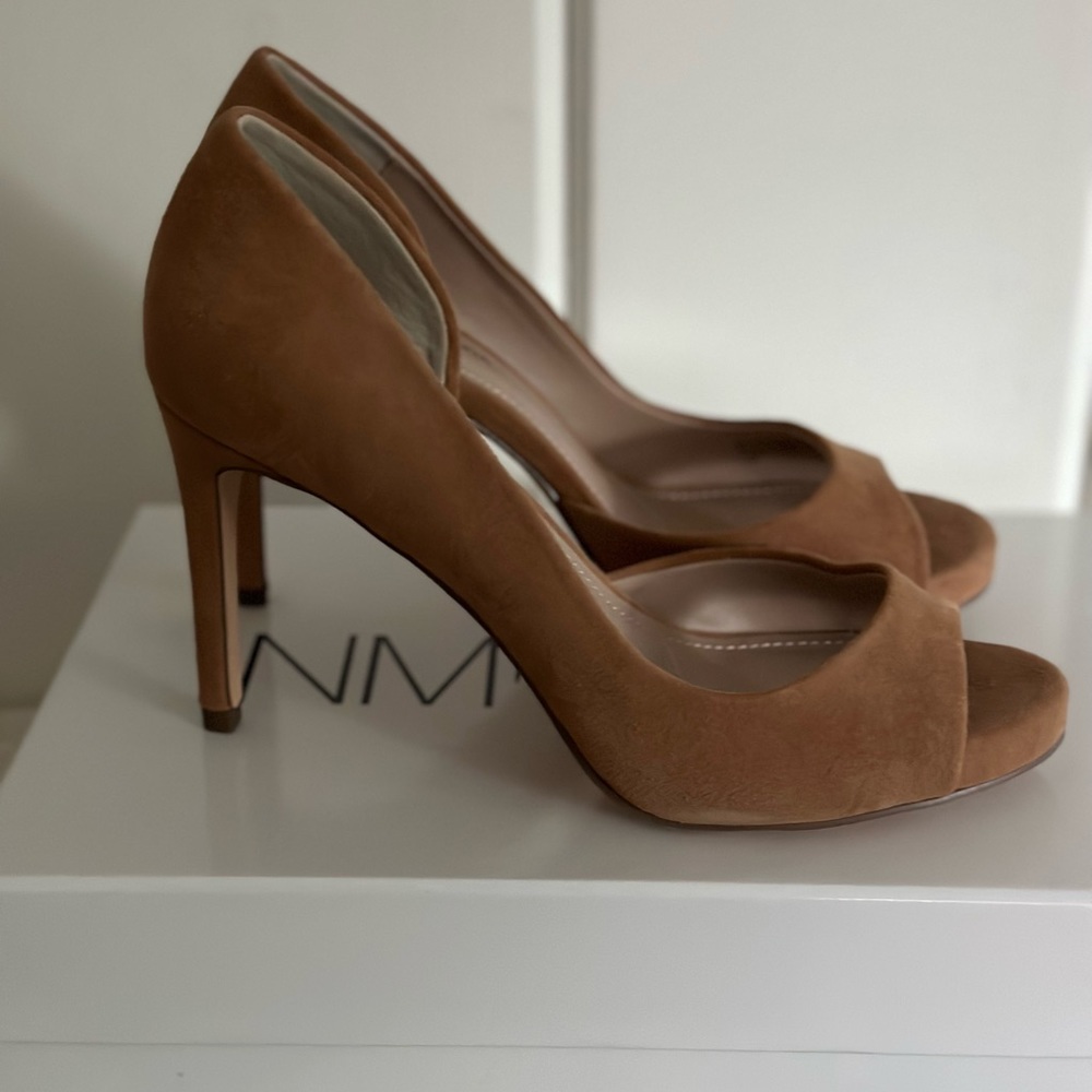Neiman Marcus tan suede peep toe pumps.